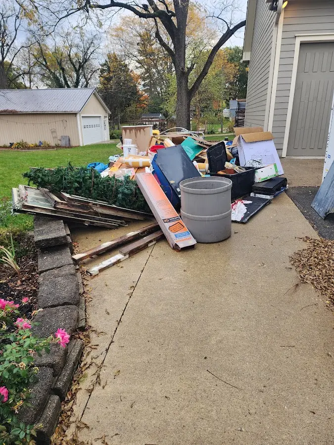 Dumpster being loaded with debris for 30 Yard Dumpster Rental in Manchester